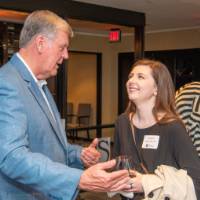 tom talking with former student